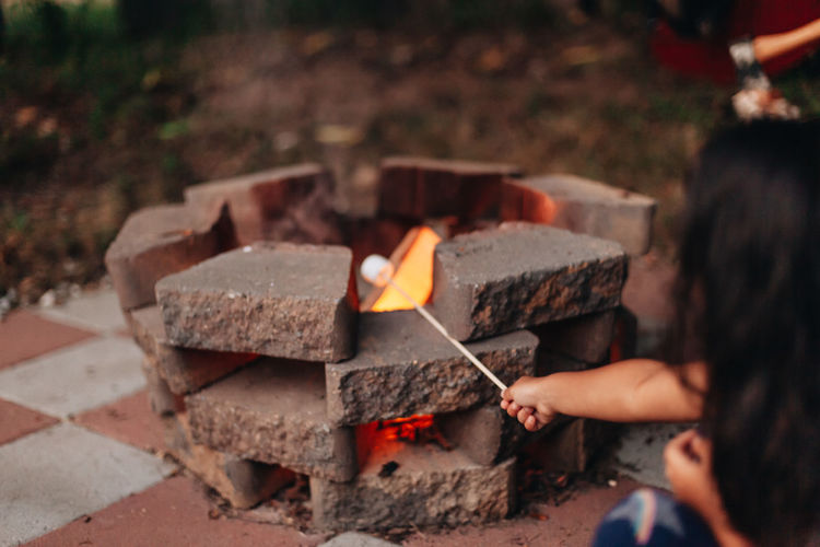 Making smores at home outdoors at the fire pit 
