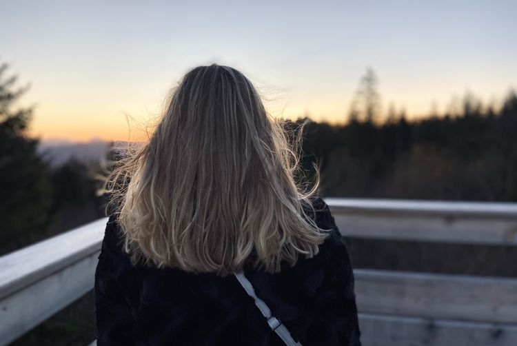 Girl from behind in sunset
