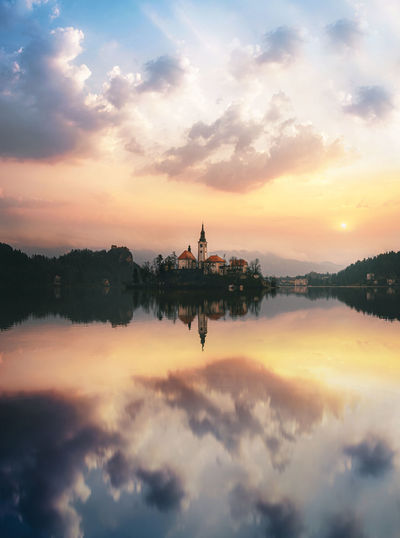 View of temple against cloudy sky during sunset