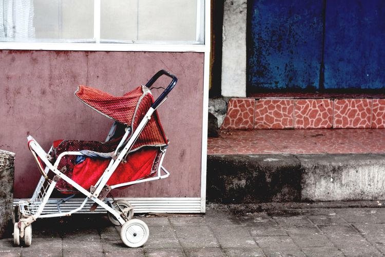 Red old baby carriage