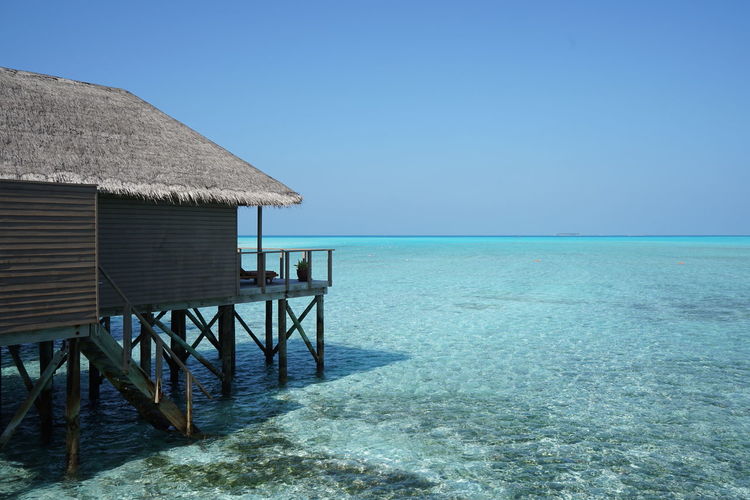 Scenic view of sea against clear blue sky