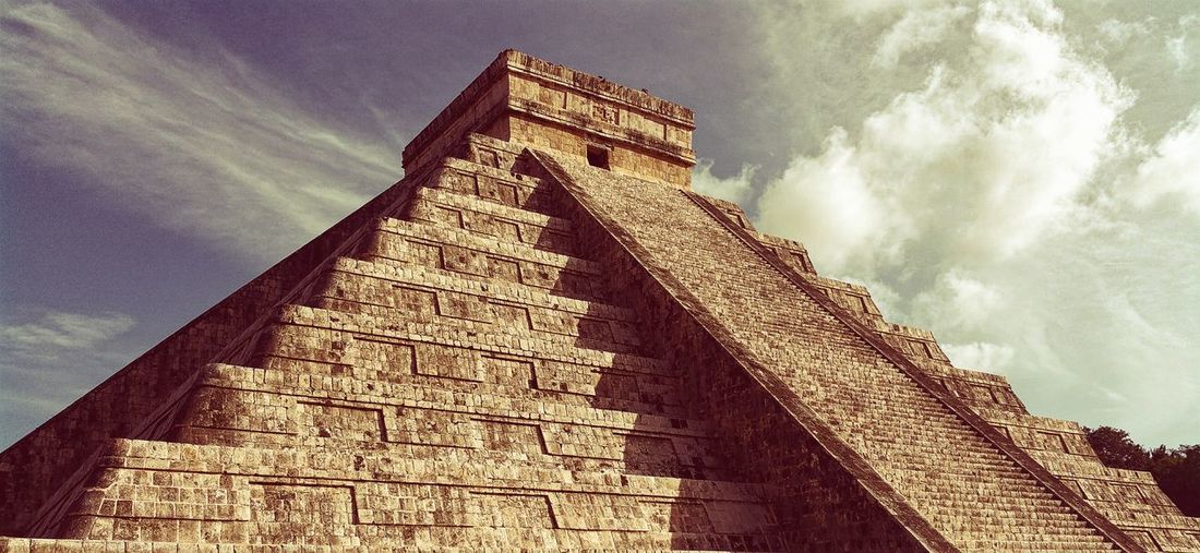 Low angle view of chichen itza against sky