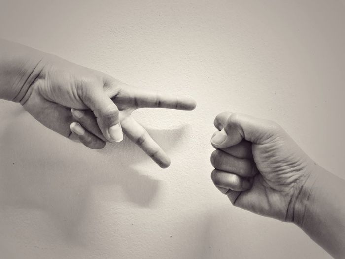 Cropped image of hands gesturing against white background
