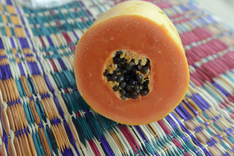Close-up of papaya on mat