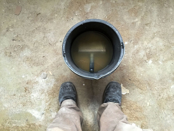 Low section of man standing on floor