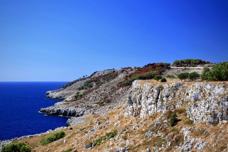Scenic view of sea against clear blue sky