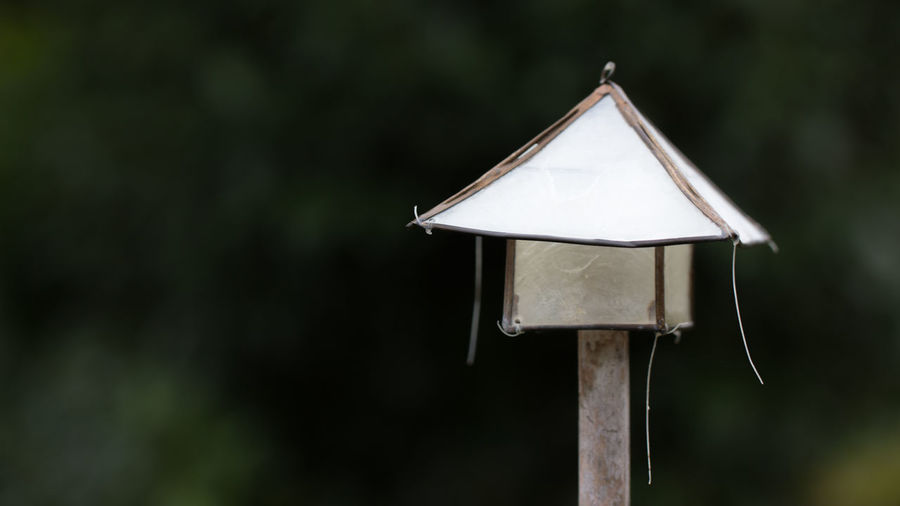 Close-up of birdhouse on land