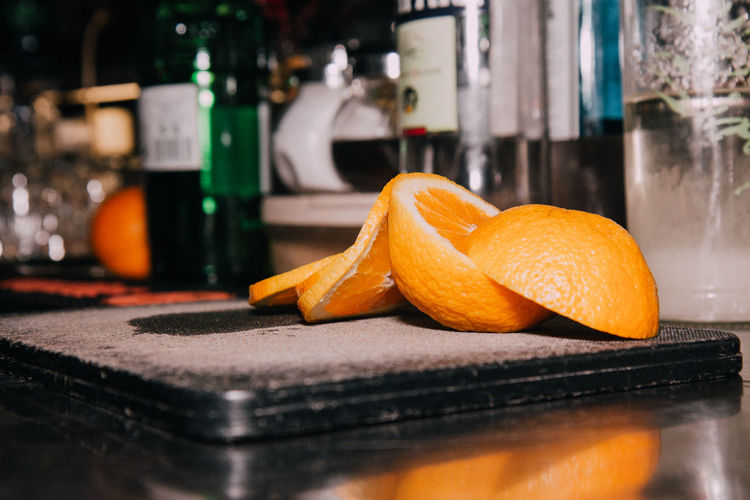 Close-up of orange slices on slate