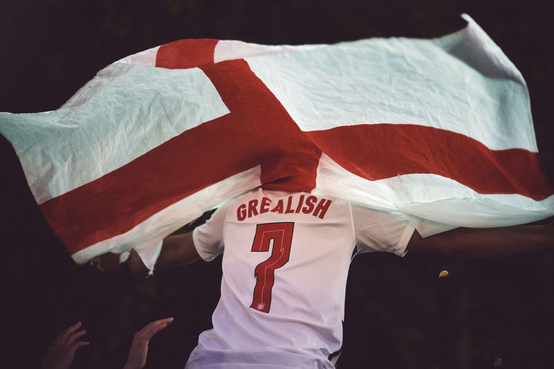 Rear view of football fan with england flag