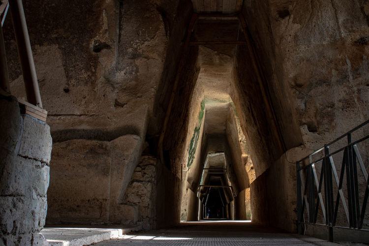 The entrance to the famous cave of the cumaean sibyl, the priestess of the oracle of apollo.
