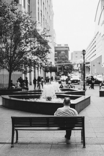People sitting in city