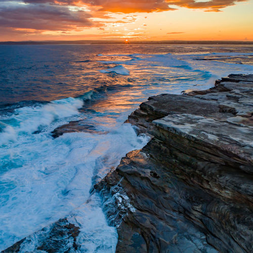 Scenic view of sea against sky during sunset