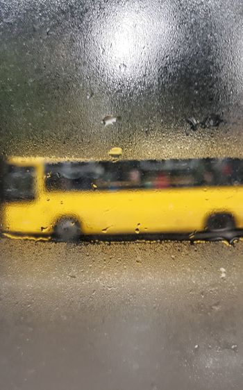 Raindrops on car window during rainy season