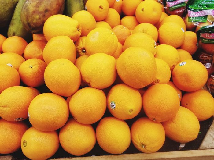 Close-up of oranges for sale at market stall