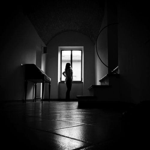 Silhouette of woman in corridor