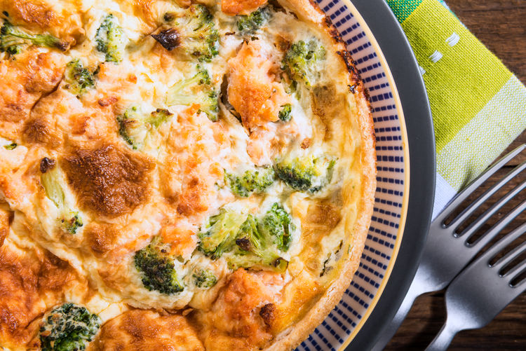 Classic salmon and broccoli quiche made from shortcrust pastry with smoked salmon