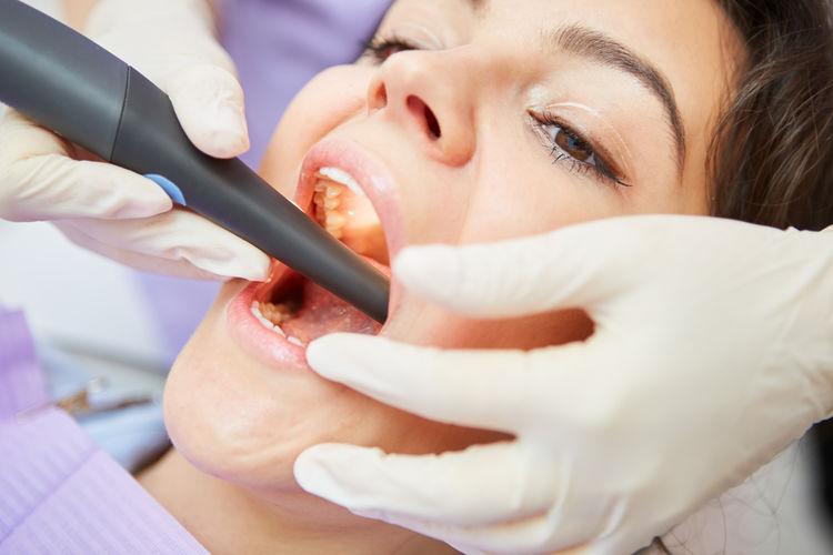 Close-up of female patient doing dental check up at clinic