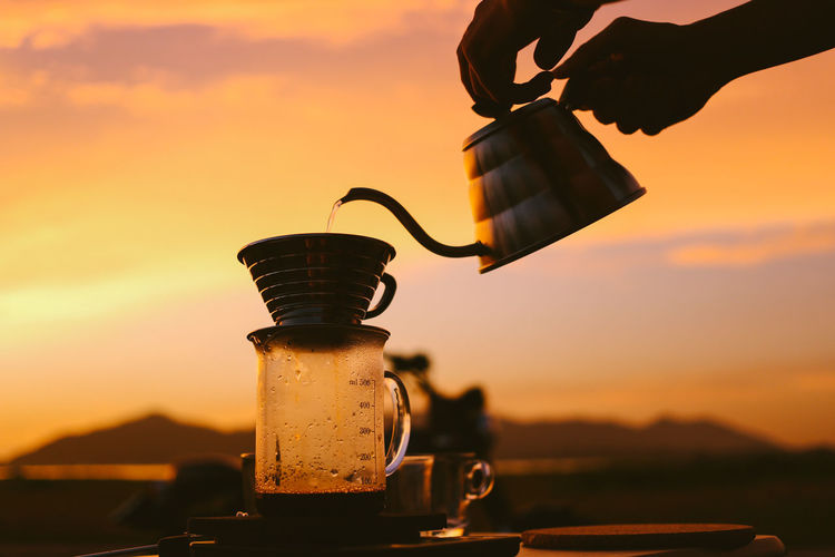 Coffee time against sunset sky.