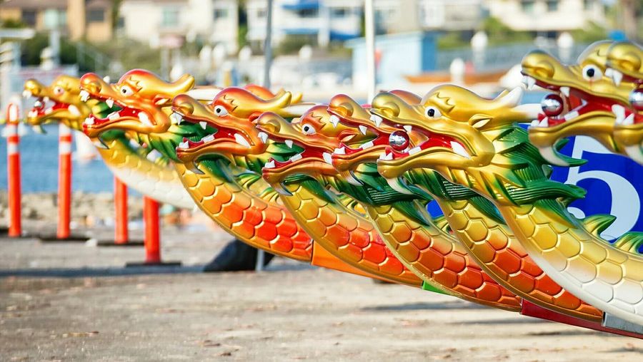 Colorful dragon boat on lakeshore during duanwu festival