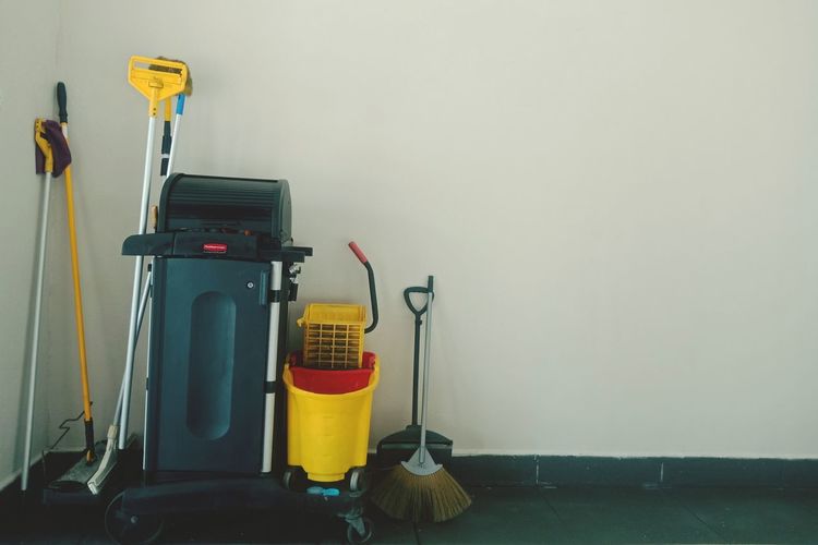 Cleaning equipment by wall