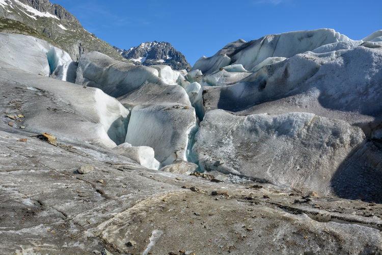 Low angle view of glacier against sky