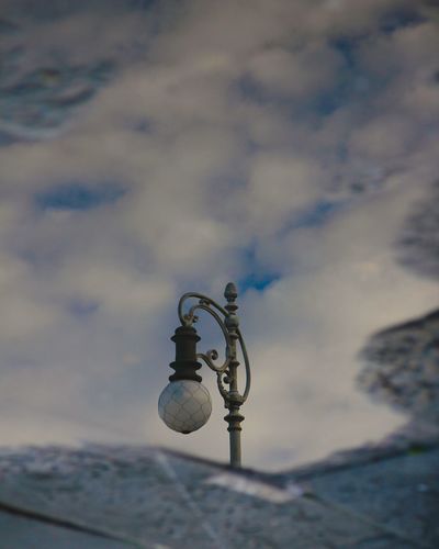 Reflection of street light on puddle