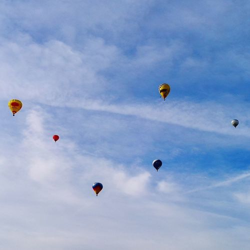 Low angle view of hot air balloons in sky
