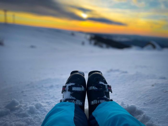 Skiing boots at sunset