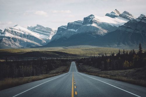Road leading towards mountains
