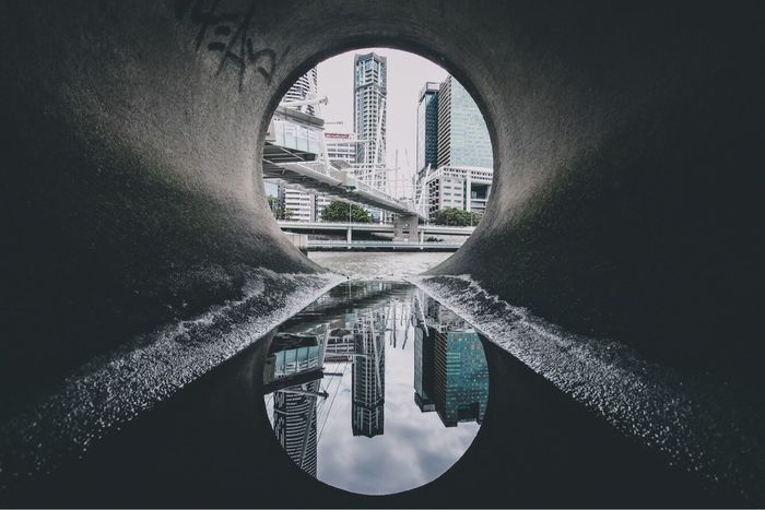 Reflection of city in water tunnel