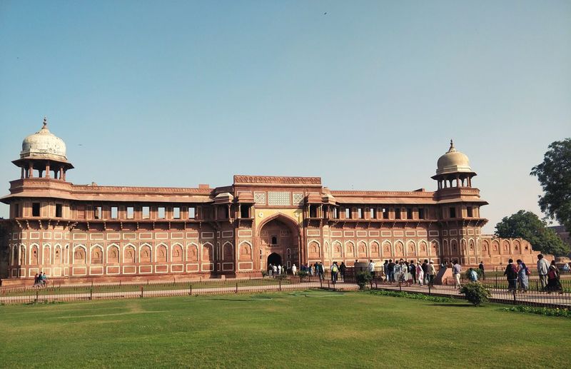 Exterior of agra fort against clear blue sky