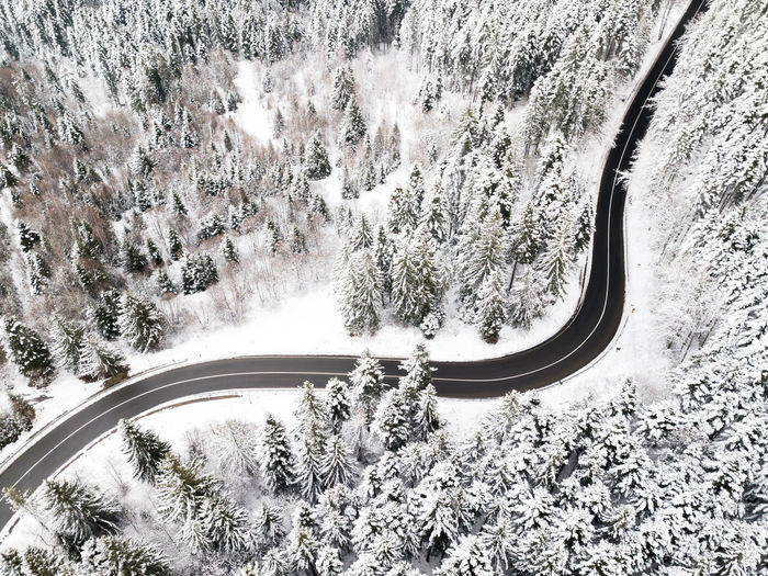 High angle view of snow covered car on road
