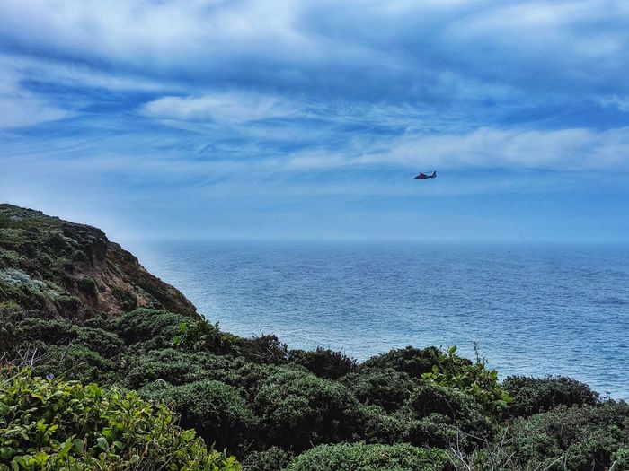 Scenic view from ocean cliff of sea against sky