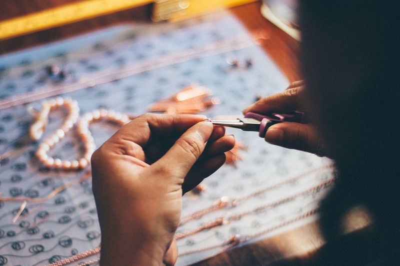 Woman working beads