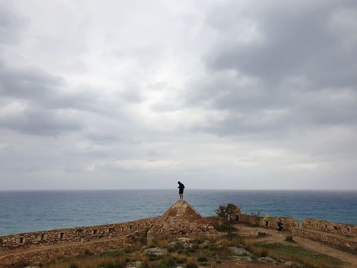 Man looking at sea against sky