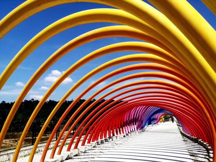 Low angle view of multi colored metallic structure
