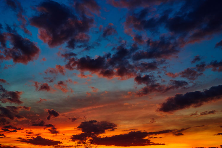 Low angle view of dramatic sky during sunset
