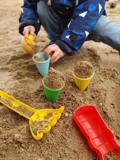 Midsection of man having food at beach