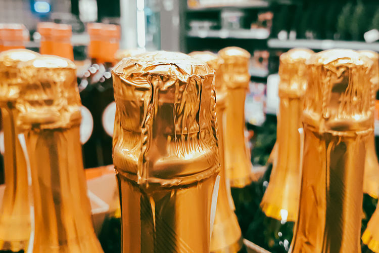 Lots of champagne bottles in store. sale of alcoholic beverages before the holiday. 