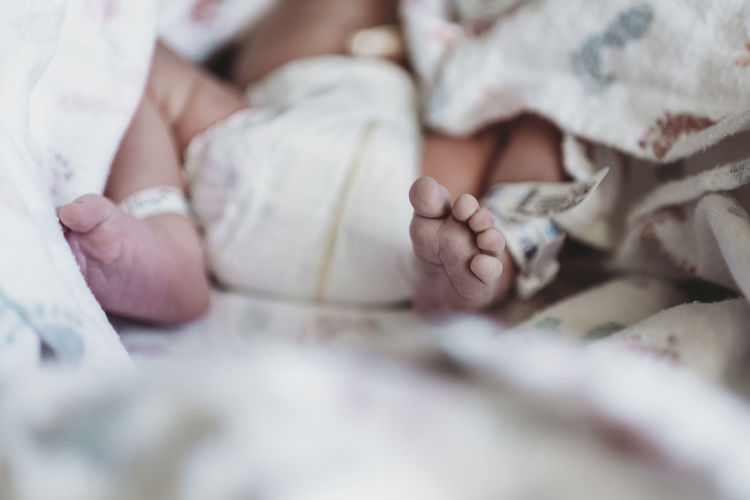Close up detail of newborn boy foot in hospital