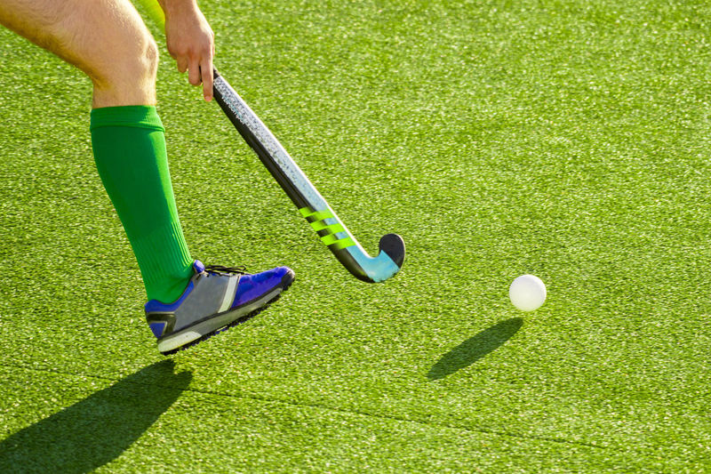 Low section of sportsperson playing hockey