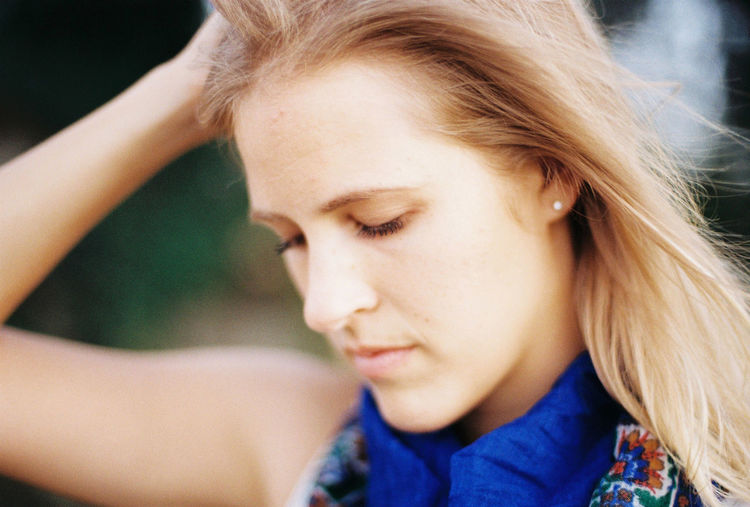 Close-up portrait of beautiful young woman looking away