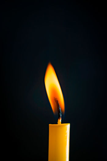 Close-up of illuminated lamp against black background