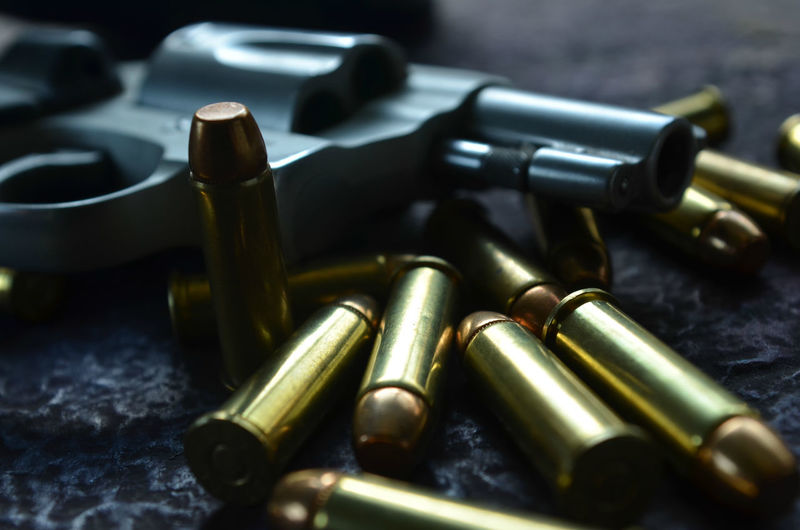 Close-up of bullets and handgun