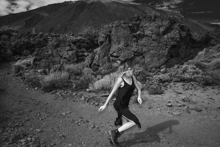 Full length of woman walking on field