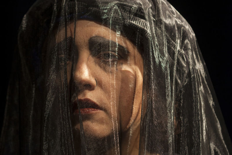 Close-up of performer wearing veil in theater