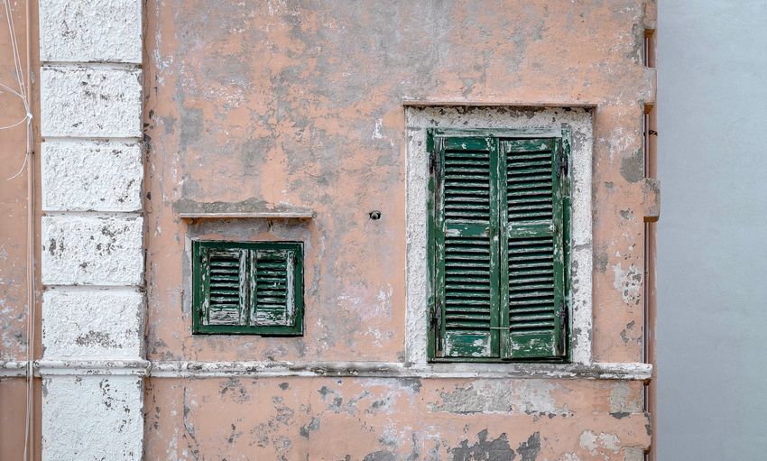 Closed windows of old building
