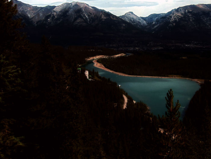 Scenic view of lake and mountains against sky