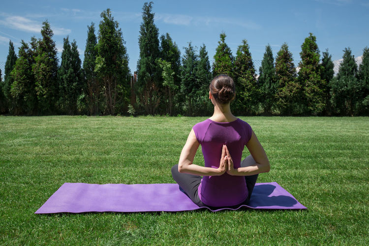 Woman practicing yoga outdoors