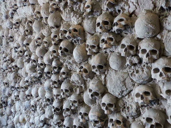 Wall build with skulls at the entrance of the torture museum of san gimignano